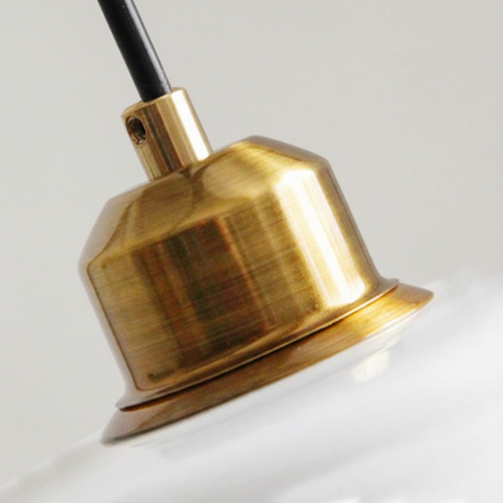 Brass cap on milk glass, with a black hang