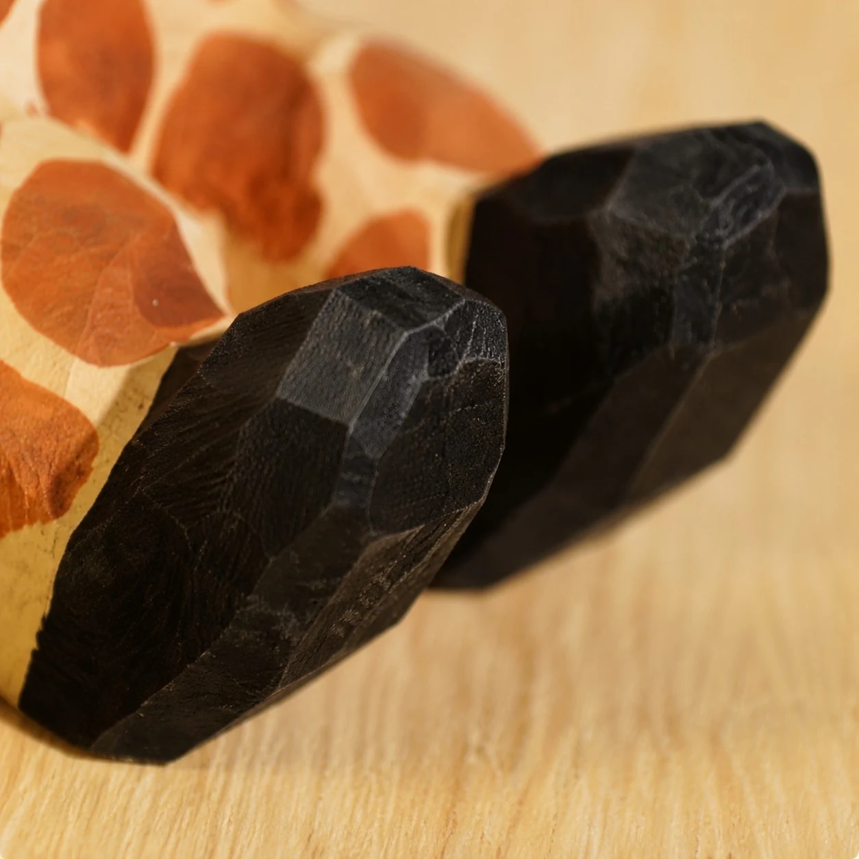 Wooden animal phone stand detail view