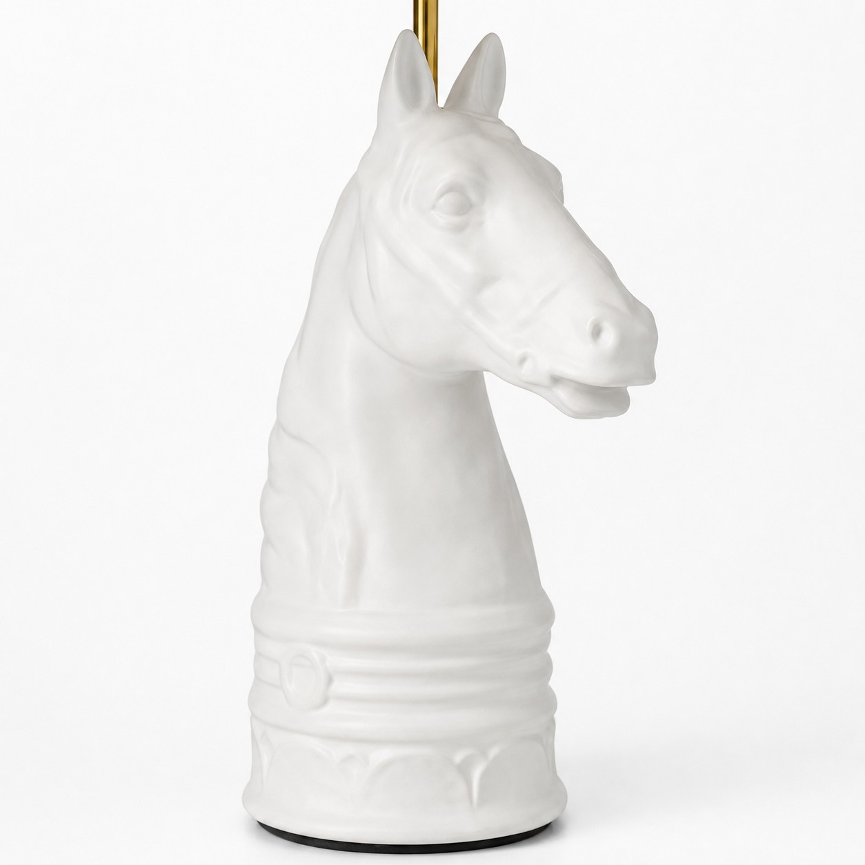 Close detail of white horse head lamp base