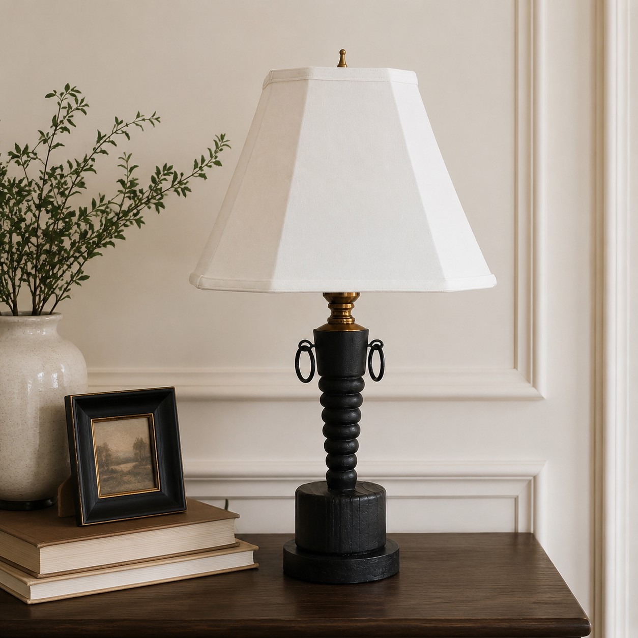 White shade table lamp styled on a side table