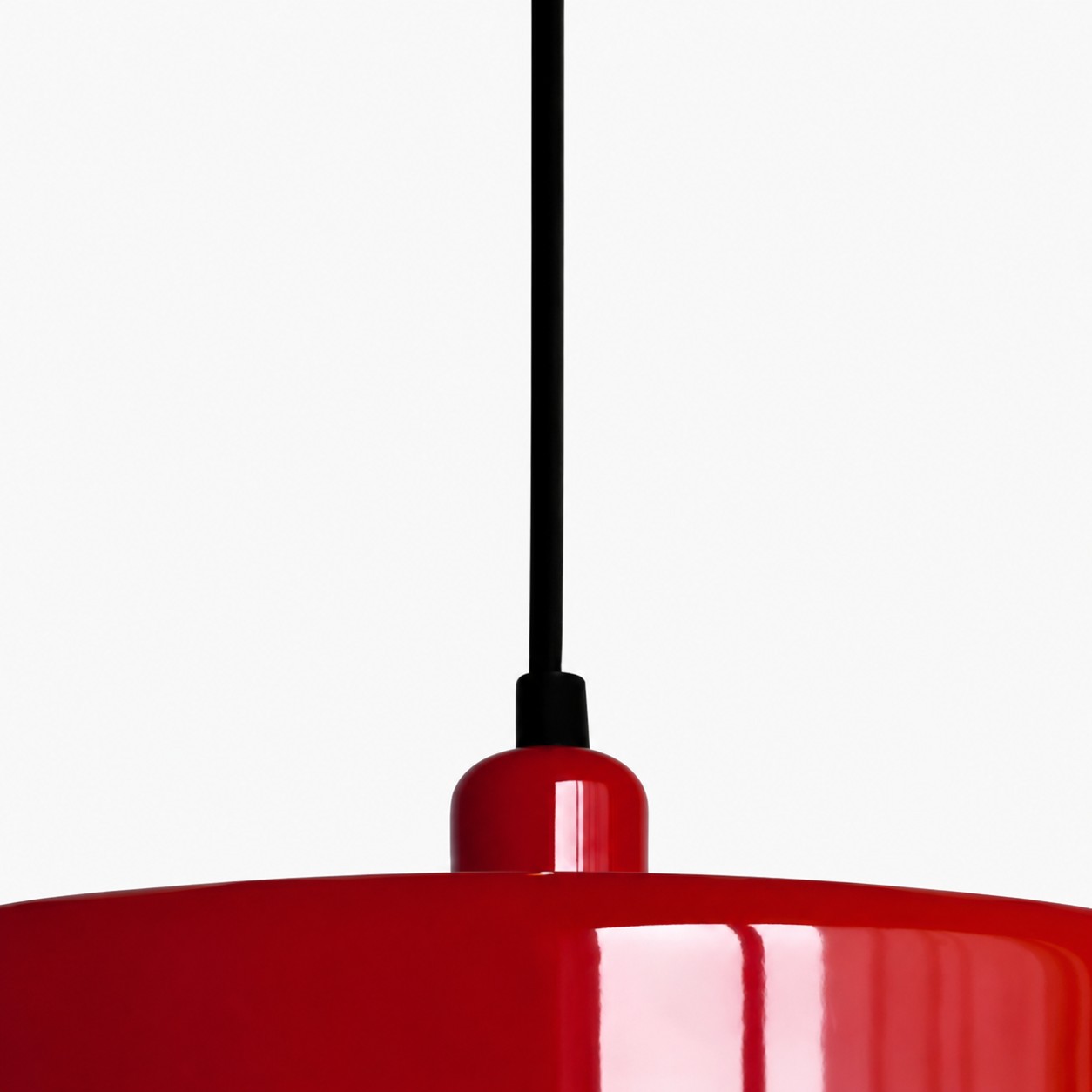 Red cap where the cord meets the shade