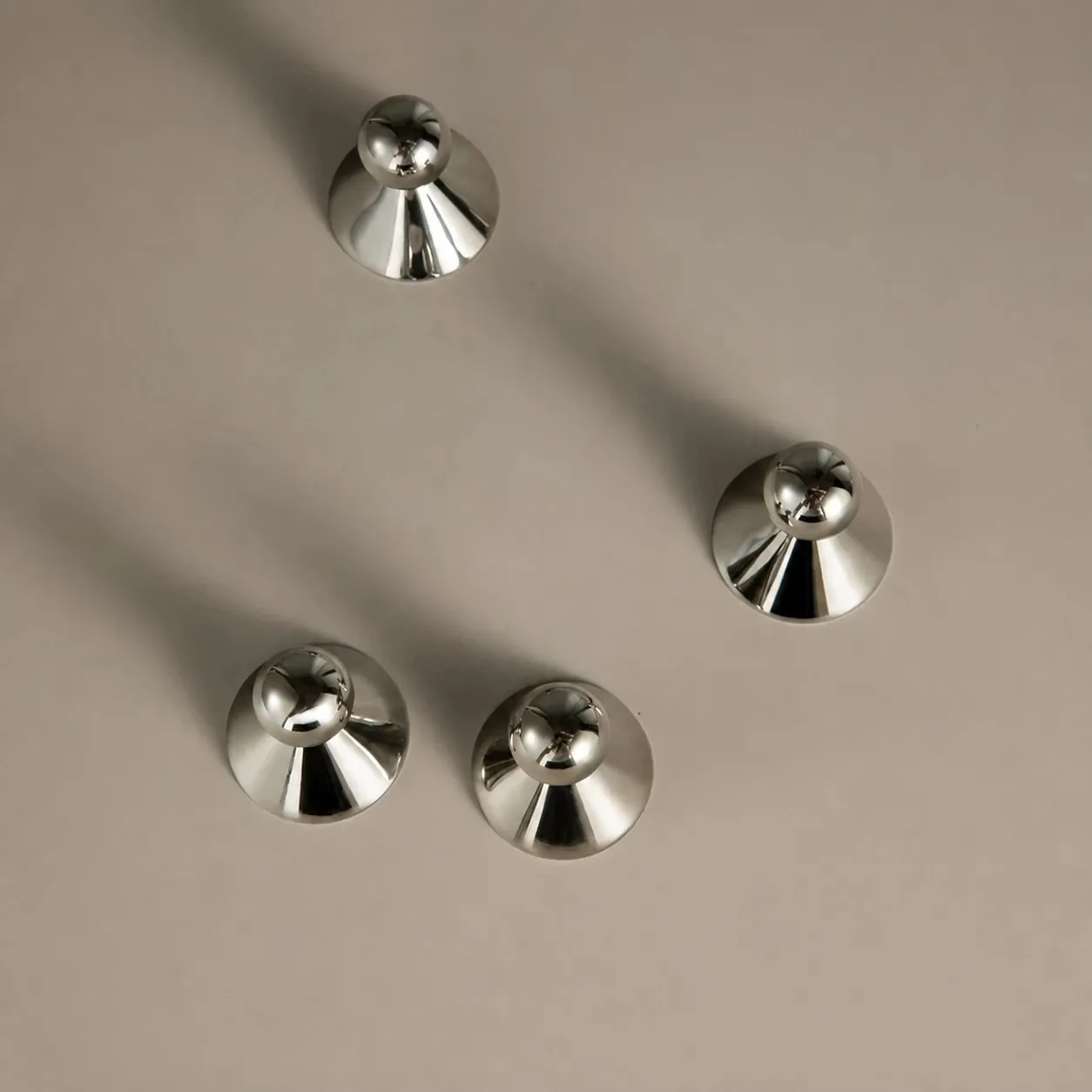 Top view of round cabinet knob bases and spherical grips
