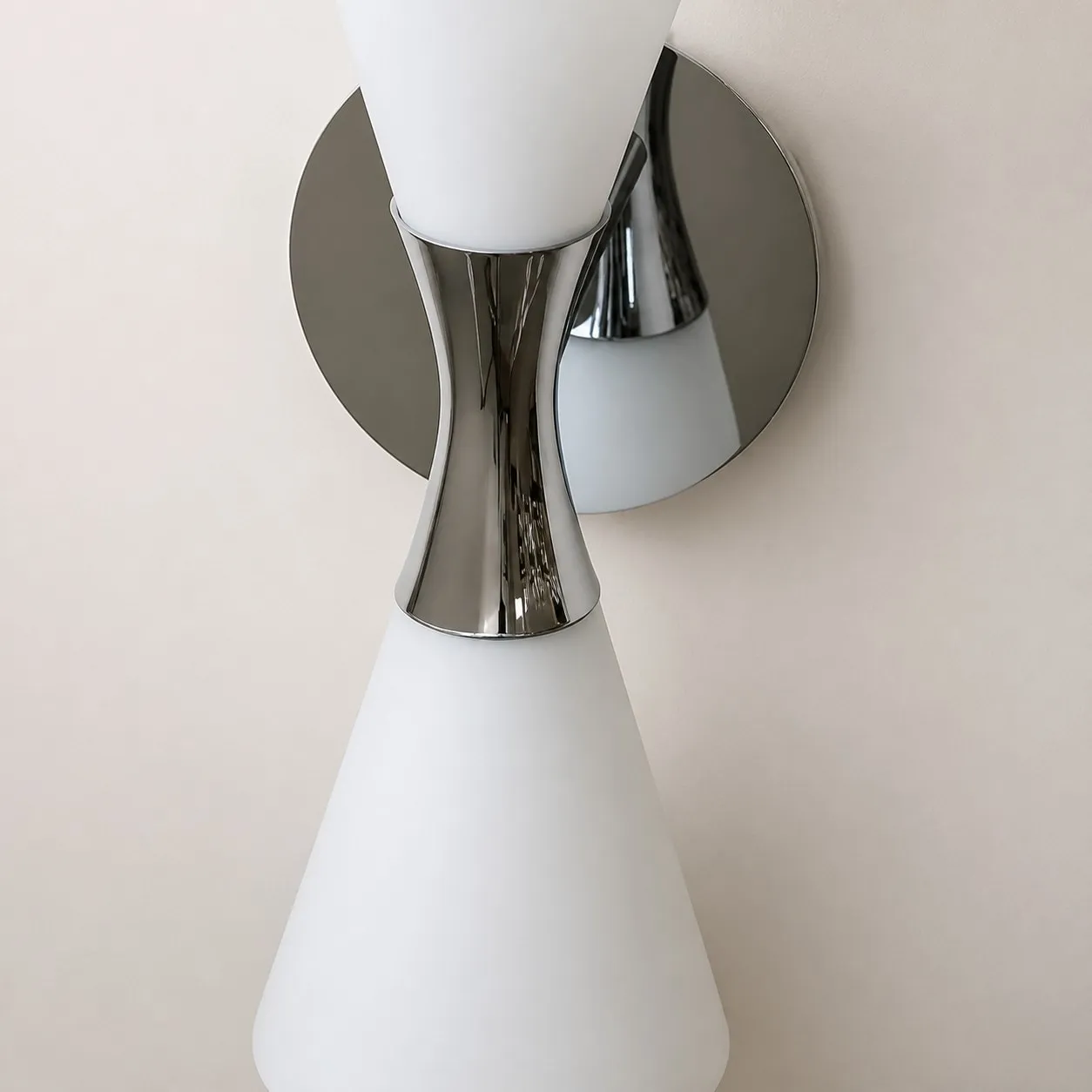 Round chrome wall plate and double shade structure detail