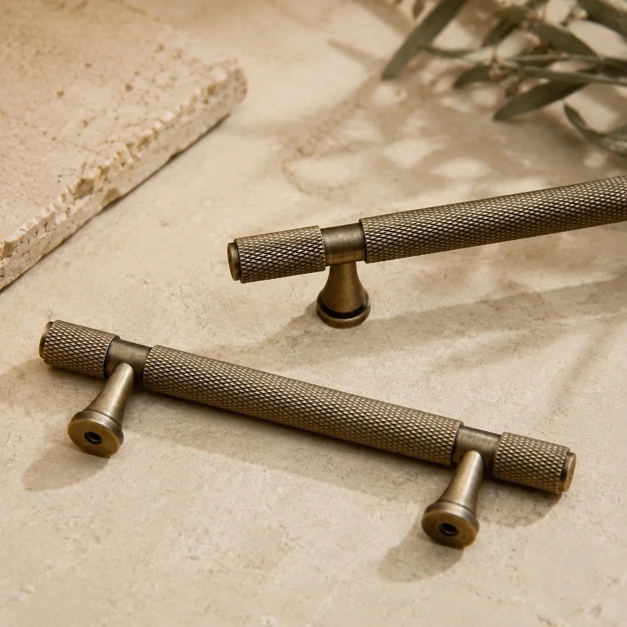 Loose antique brass cabinet pulls showing full shape
