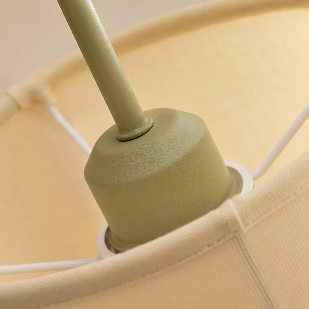 Fabric shade support and painted metal socket housing detail