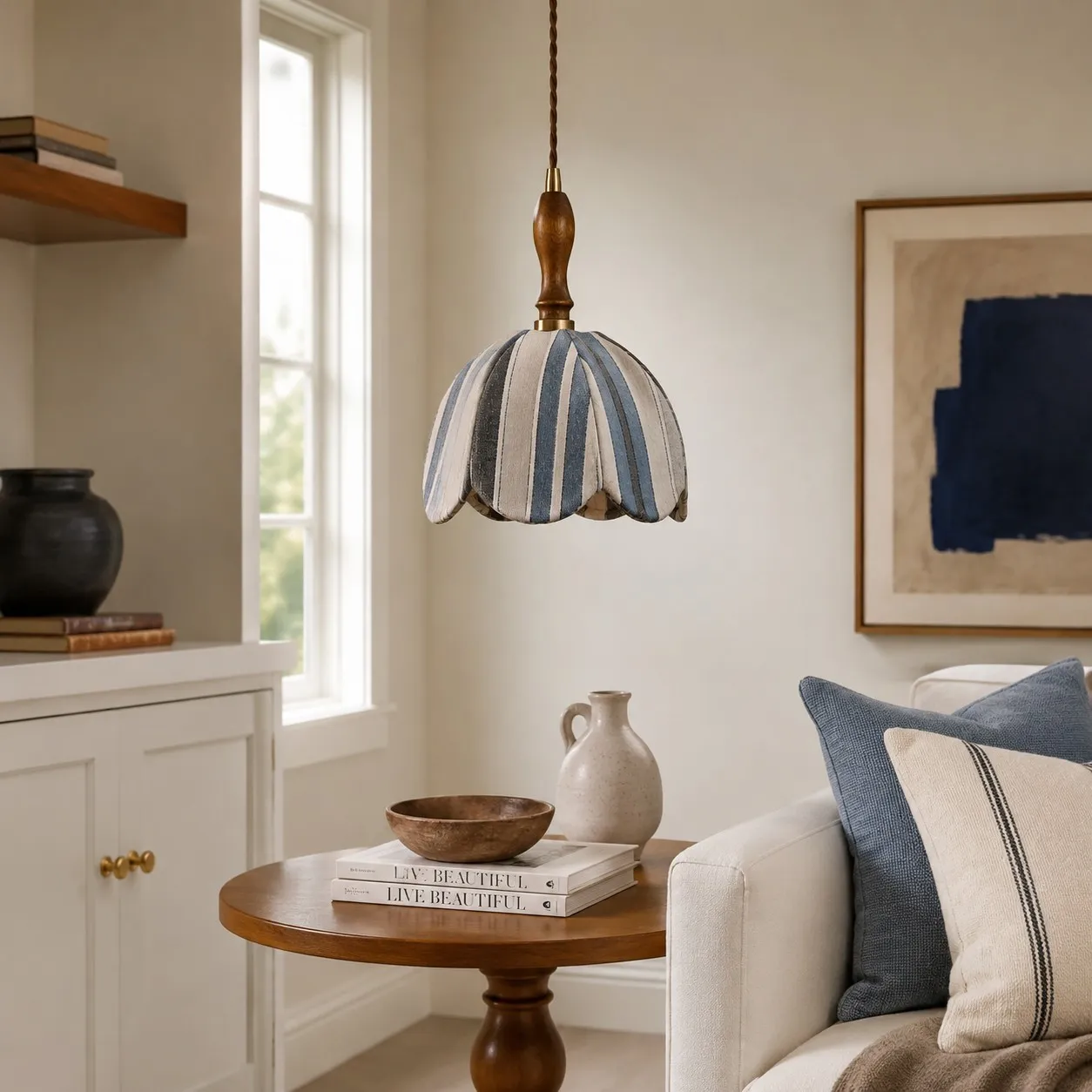 Blue and ivory striped fabric pendant lamp installed in a warm bedroom corner